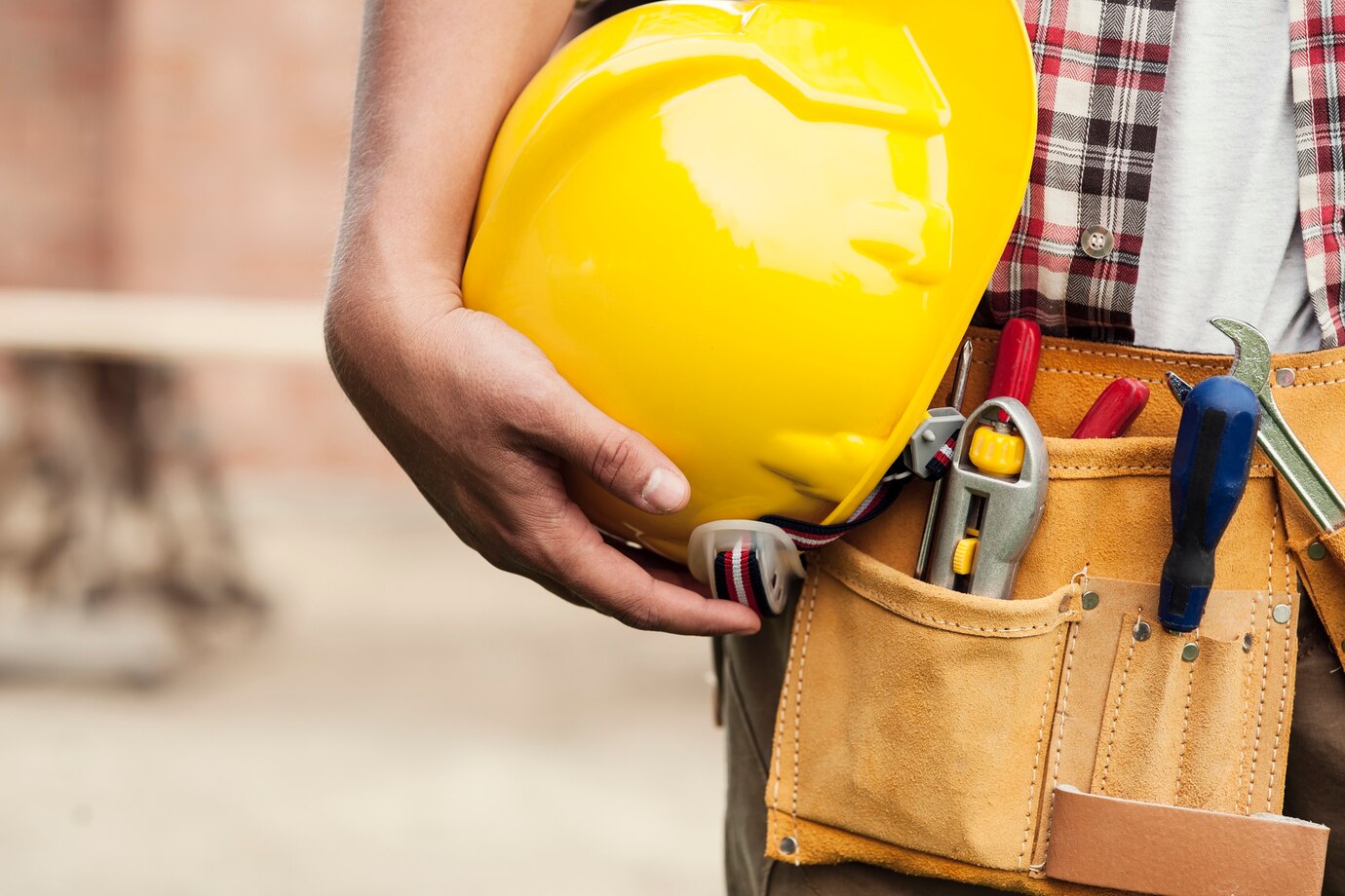 close-up-hard-hat-holding-by-construction-worker_329181-2825